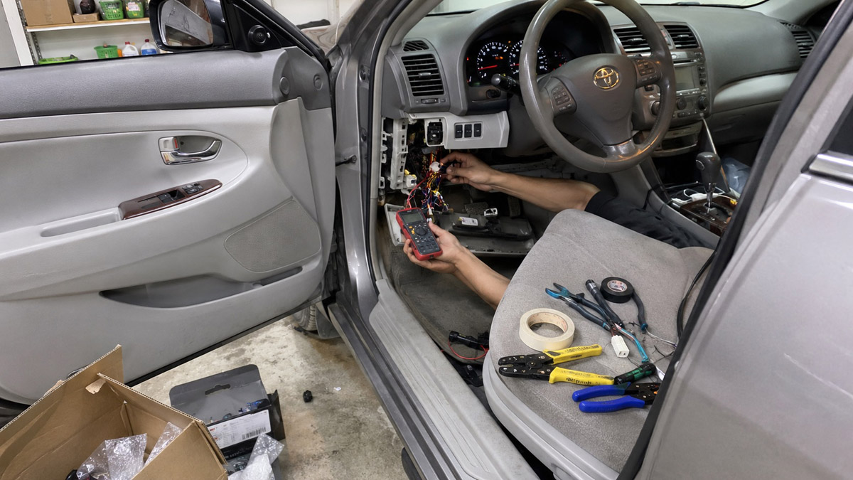 Wiring push start system with multimeter and tools